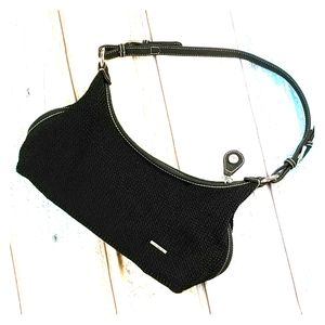 The sak small handbag. Woven with fabric accents.